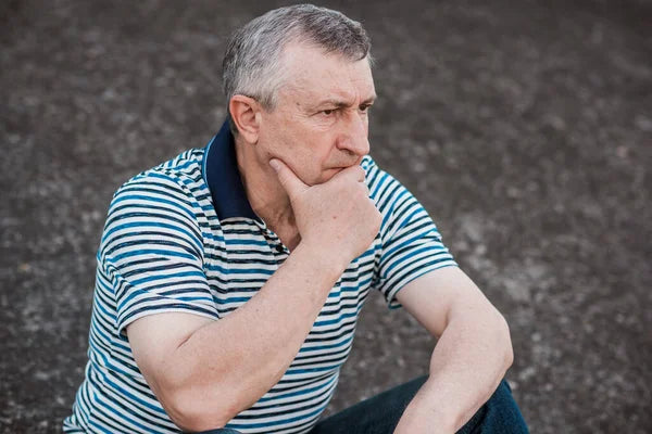 files/depositphotos_659096932-stock-photo-older-man-sad-philosophical-mood.webp
